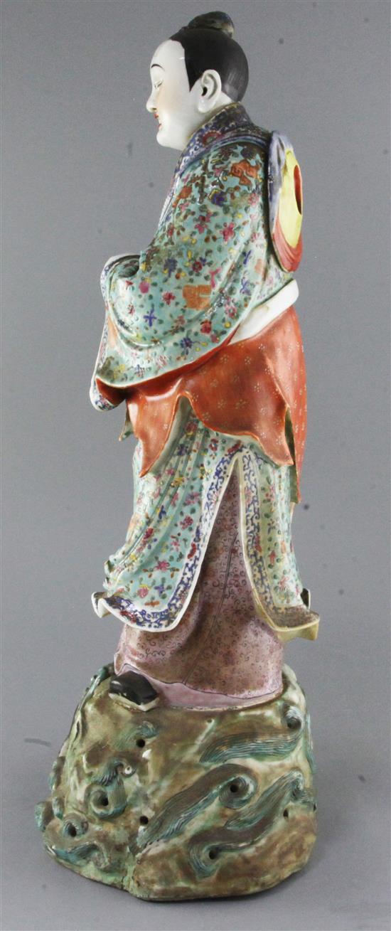A large Chinese famille rose figure holding a flute, late 19th century